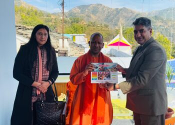 CM Yogi Adityanath Receives Meri Yojana Book from uttarakhand sarkar